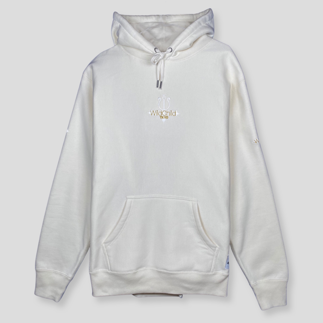 Off white creamy heavyweight hoodie. Embroidered WildChild TKYO logo in Ice White and Gold. Antique metal eyelets and drawstring tips. Premium quality.